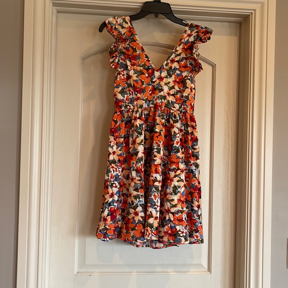 Floral, light and flowy open back dress that ties in the back.